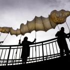 Parading a taniwha lantern in Dunedin yesterday (from left) are  Midwinter Carnival lantern...