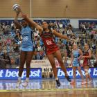 Steel goal shoot Jhaniele Fowler-Reid claims a pass despite the efforts of Tactix goal keep Temalisi Fakahokotau during their ANZ premiership match at the Edgar Centre yesterday. Photo: Gerard O'Brien.