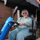 Central Otago Grey Power committee member Eileen Rawlings  drives her mobility scooter on to the...