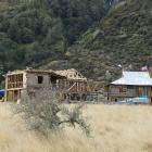 Two wooden houses have been built on a site believed to be one of the locations where the sixth...