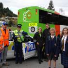 New signs have been installed on Go Bus' school bus fleet in Queenstown and Wanaka. Pictured with...