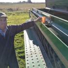 Waimate farmer Guy Wigley calibrates his drill before planting more wheat while the sun shines...
