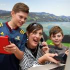 Ed Sheeran fan Trista Townsend and sons Jonty (11, left) and Harry (9), of Dunedin, prepare to...