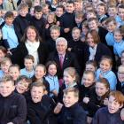 Celebrating a Government announcement of $5 million for Otago classrooms with a sea of Cromwell...