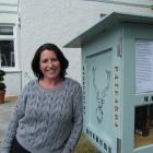 Maniototo resident Amie Pont shows off Ranfurly’s first Lilliput Library, outside her business...