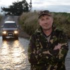 Callum Fissenden cleans his 4WD in a ford in East Taieri. Photo: Linda Robertson