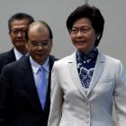 Hong Kong Chief Executive-elect Carrie Lam enters a news conference with Chief Secretary Matthew Cheung and Financial Secretary Paul Chan. Photo: Reuters