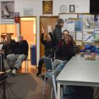 Port Chalmers Yacht Club members celebrate as Team New Zealand crosses the line to win the...
