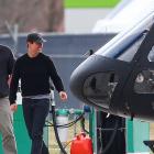 Actor Tom Cruise (right) chats to Andy Clayton at Queenstown Airport yesterday after a helicopter...