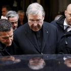 Australian Cardinal George Pell leaves at the end of a meeting with the victims of sex abuse in...