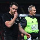 Ben Smith leaves the field after taking a head knock during the first test between the All Blacks...