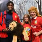 British and Irish Lions lock Maro Itoje poses for a photograph with team mascot BIL and...
