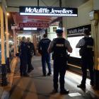 Police attend the scene of an armed robbery at McAuliffe Jewellers in South Dunedin last night. Photo: Linda Robertson