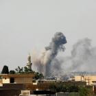 Smoke rises from an air strike by Iraqi forces towards Islamic State militants in the Old City of...