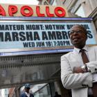 Historian Mitchell poses outside the Apollo Theater in the Harlem, NYC. Photo: Reuters