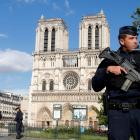 French police and gendarmes stand at the scene of a shooting incident near the Notre Dame Cathedral in Paris. Photo: Reuters