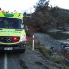 Emergency services attend a one-vehicle crash at Wilson Bay yesterday. Photo: Louise Scott