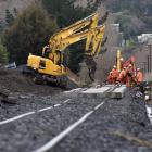 Workers upgrade the railway line near Factory Rd, Mosgiel, yesterday. Photo: Peter McIntosh.