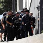 Police officers prepare to enter a UPS facility after a gunman opened fire inside the building in San Francisco. Photo: Reuters