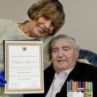 Vietnam War veteran Bruce Abernethy, with his wife Kathy, who is holding  a certificate of...