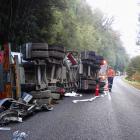 Attempts are made to salvage a crashed fuel tanker off the Haast Pass road  yesterday afternoon....