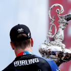 Peter Burling, Emirates Team New Zealand Helmsman holds the America's Cup after defeating Oracle...