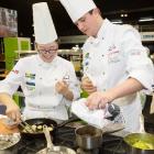 Otago Polytechnic Central Campus chefs Freda Zhang (left) and Sam Farr cook their way to a silver...