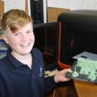 Cromwell College pupil Edward Lawrence (11) whips up parts one of the school’s 3-D printers for a...