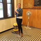 26 Ross Pl Cafe owner Liz McLaughlin begins cleaning after her business was affected by the...