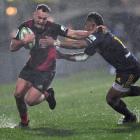 Israel Dagg of the Crusaders is tackled by Waisake Naholo of the Highlanders. Photo: Getty