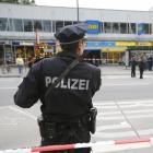 A police officer looks on after a knife attack in a supermarket in Hamburg. Photo: Reuters