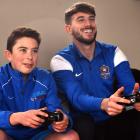 Playing Fifa 17 are Rory Hibbert (12) and Southern United player Conor O’Keefe, who has featured...