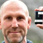 Mat Blair with the new GPS unit (left) compared to the old one (right). Photo: Peter McIntosh.