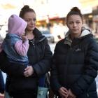 Amy Stuart, holding her daughter, and Kylie Taggart are at odds with the Ministry of Social...