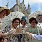 People in period costume pose with the new £10 note featuring Jane Austen. Photo: Reuters