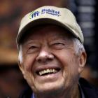 By Friday morning, former US President Jimmy Carter was smiling as he returned to the building...