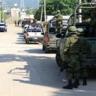 Soldiers stand outside a prison after a riot broke out at the maximum security wing in Acapulco,...
