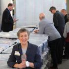 Holding the last tie counted, Irene Sparks relaxes with her world-record-breaking tie collection...