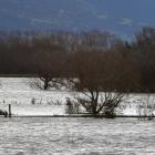 The main trunk railway line disappears into floodwaters at Otokia on the Taieri Plain yesterday....