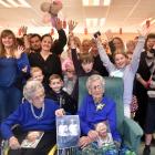Identical twins Cora Wright (left) and Elsie Fagg celebrate their 100th birthday with family a...