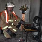 Alexandra Chief Fire Officer Russell Anderson inspects the scene of a suspected arson at...