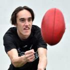 Otago Australian football player Josh Mackie gets some practice in before travelling to Melbourne...