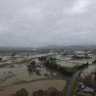 An aerial view of water from the flooded Tokomairaro River spreading over the plains south of...
