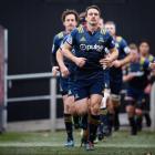 Ben Smith of the Highlanders leads his team onto the field. Photo: Getty