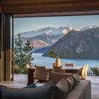 The covered outdoor room faces the lake but can be sheltered from the wind by stacking doors that...