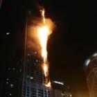 Flames shoot up the sides of the Torch tower residential building in the Marina district, Dubai,...