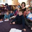Poet Sue Wootton, pictured  with members of her Karitane School poetry class, says the process of...