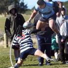 Kings High School centre Giovanni Leituala leaps over Otago Boys High School fullback Isaak Te...