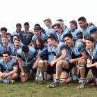 The King’s High School first XV celebrates with the trophy after beating  John McGlashan College...