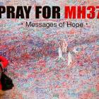 A woman leaves message of support and hope for passengers of missing Malaysia Airlines MH370 in...